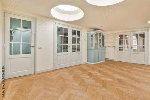 Spacious and modern room with herringbone flooring