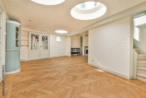 Spacious interior with hardwood floors and natural lighting