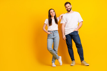 Full body photo of attractive young man woman posing models shopping dressed stylish white clothes isolated on yellow color background