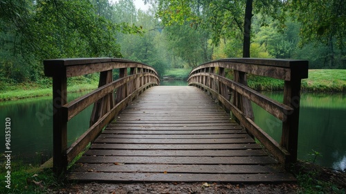 Wooden Bridge Over Tranquil Stream