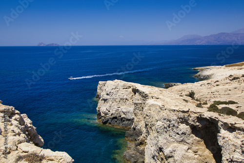 Lookout point between Matala and Red beach with cliffs in hot summer. Paximadia island in background. Greece, Crete 2024