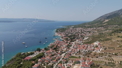 Panoramic Dron View Croatia, Brac Island, Bol. Dominician Monastery and Martinica Beach on Adriatic Sea. Summer Vacation Resort. Tourists and Boats on the Shore of the Beach in Bol, Croatia. photo