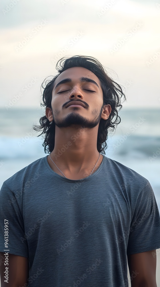 Young boy deep in thought at sunset beach Young boy deep in thought at sunset beach