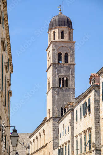 Church and bell tower of the Franciscan friary situated at the Stradun, the main street of Old town Dubrovnik in Croatia photo