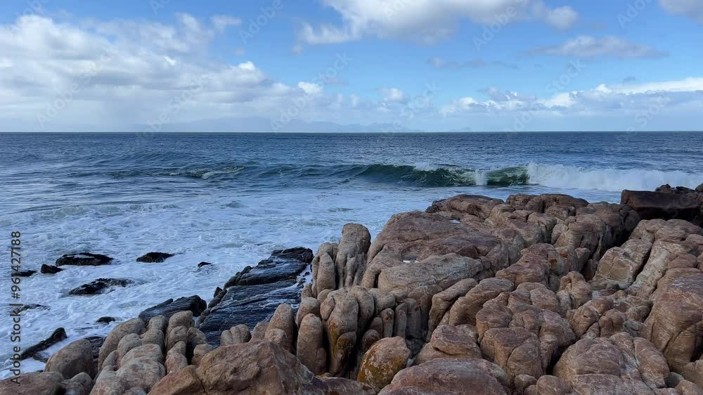 Rocky shore with waves washing over the big beach boulders Rocky shore with waves washing over the big beach boulders