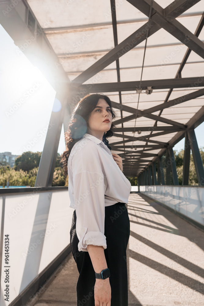 Confident Woman in Modern Urban Architecture with Sunlit Perspective Confident Woman in Modern Urban Architecture with Sunlit Perspective