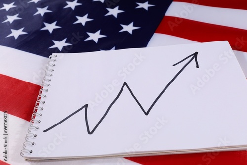 Growth trend analysis on notepad over American flag background photo