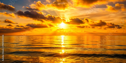 Golden sunset over a calm sea, clear weather, warm glow on the horizon