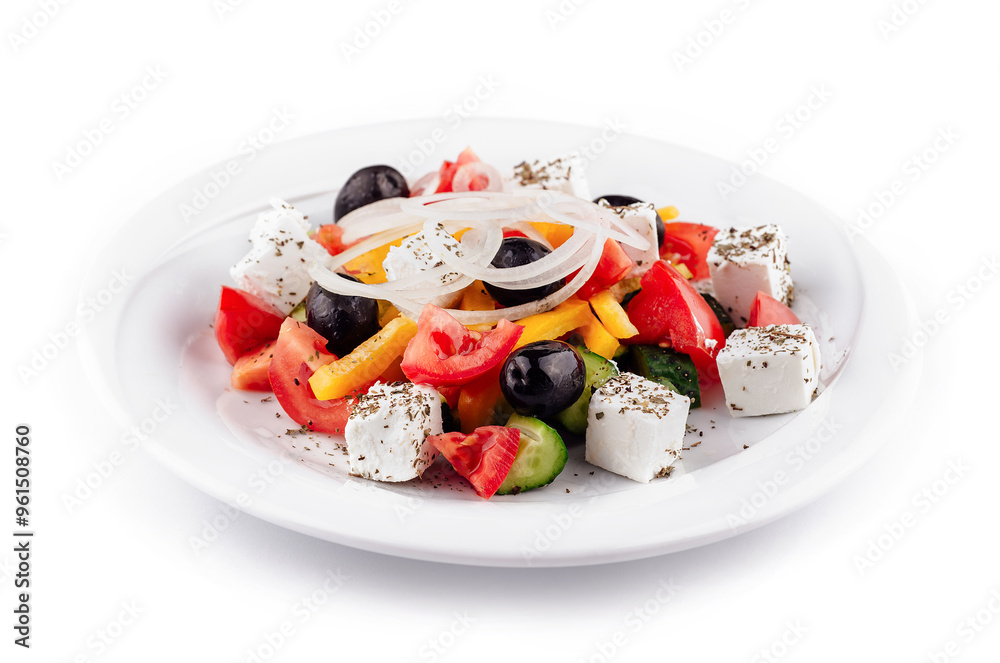 Greek salad with feta cheese, olives, and vegetables on white plate Greek salad with feta cheese, olives, and vegetables on white plate