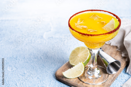 Fresh mango cocktail. Mexican mango cocktail on blue background. Copy space photo