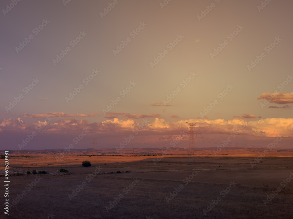 Fotografie Nubes junto a torres de alta tensión
