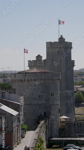 The Chain Tower ( Tour de la Chaîne )  with the Saint-Nicolas Tower ( Tour de la Chayenne ) behind it at La Rochelle photo