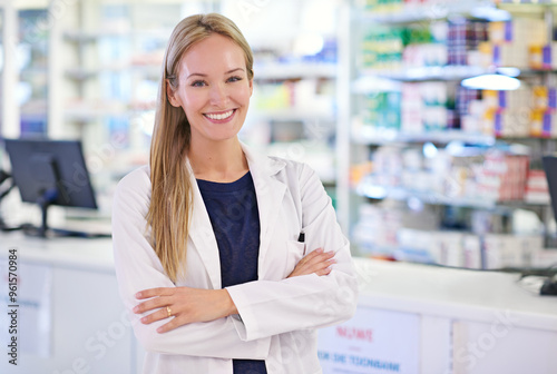 Woman  arms crossed and portrait with smile at pharmacy for customer service  medication and prescription. Happy  pharmacist and medical worker at dispensary for healthcare  supply or pharmaceuticals
