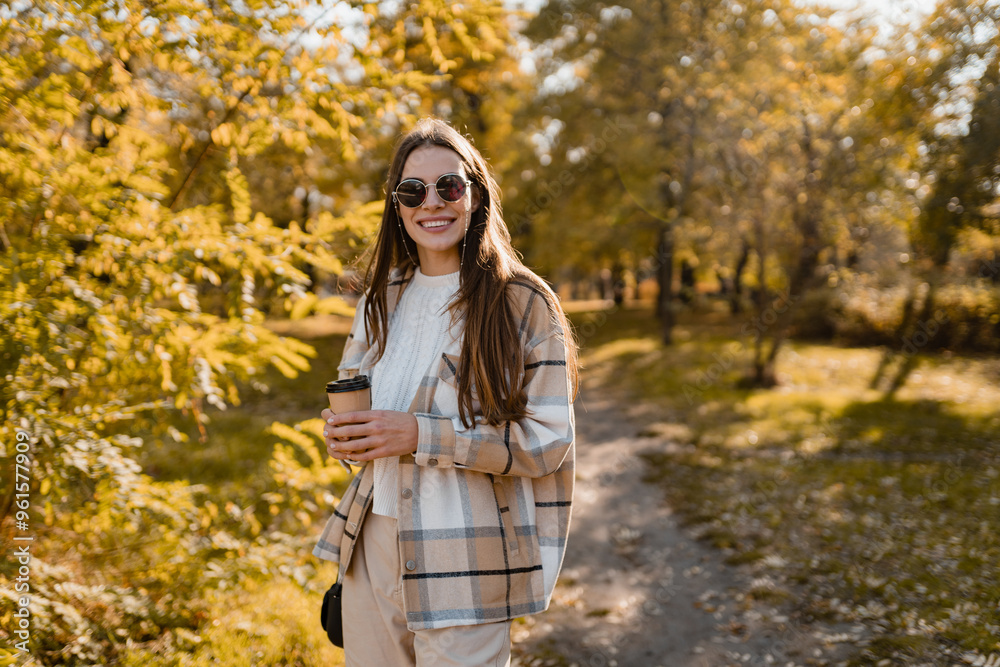 attractive young woman walking in autumn wearing jacket attractive young woman walking in autumn wearing jacket