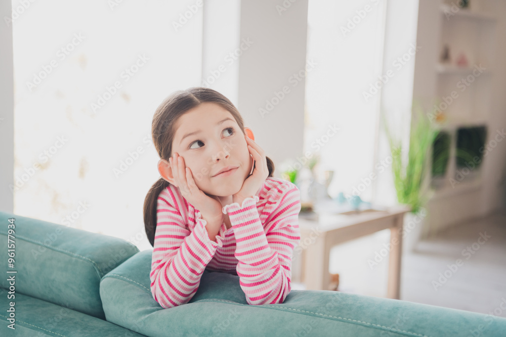 Close up photo of adorable preteen lovely funny kid little brunette girl staying at home spending holidays lying on couch isolated in her room Close up photo of adorable preteen lovely funny kid little brunette girl staying at home spending holidays lying on couch isolated in her room