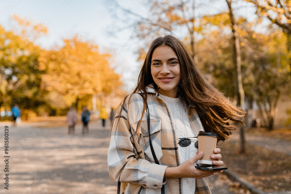 attractive young woman walking in autumn wearing jacket attractive young woman walking in autumn wearing jacket