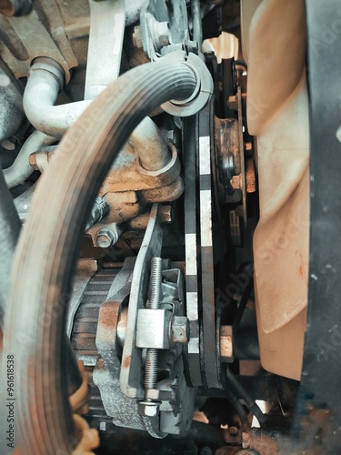 Car engine, top view. Drive belts on an old motor.