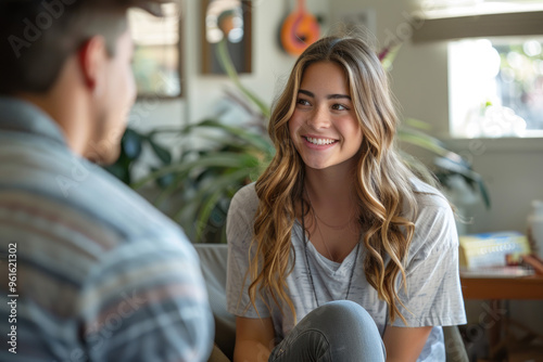 Casual Conversation Between Friends in Cozy Living Room Setting with Modern Decor