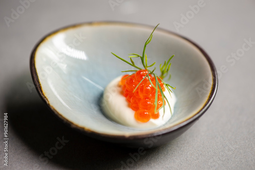 red caviar on creme fraiche with dill photo