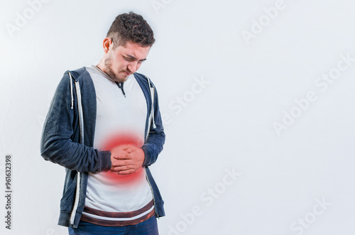 Unhappy man with digestive problems isolated. Person with digestive and stomach problems isolated photo