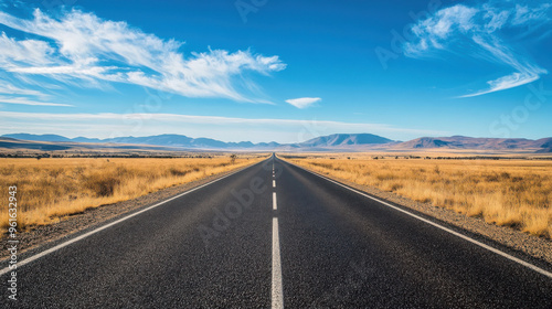 Scenic road through the outback in Australia, with vast open landscapes.