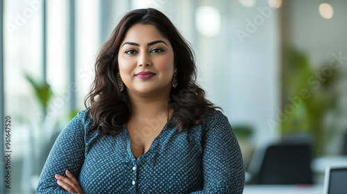 Confident plus size Indian woman in a professional office environment Free Download Confident plus size Indian woman in a professional office environment - GFXLoad