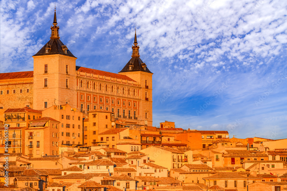 Toledo, Castilla La Mancha - Spain. Old city across the river Tajo and Alcazar in the sunset golden light.