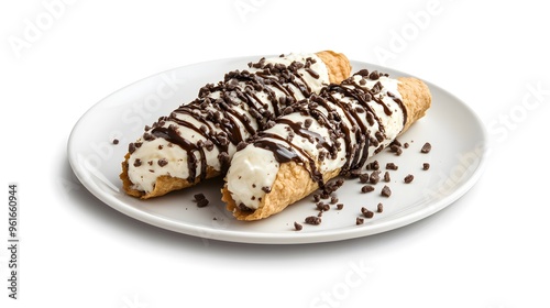 Delicious cannoli with cream filling and chocolate chips on plate