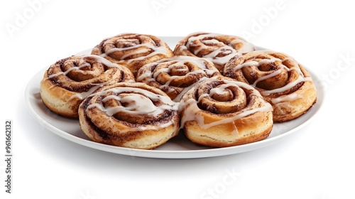 Delicious cinnamon rolls with icing on a white plate