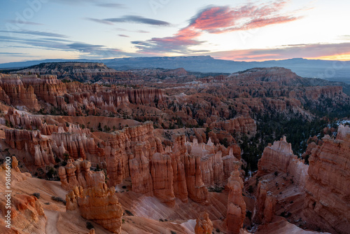 Stunning sunrise views of red rocks and hoodoos at Bryce Canyon National Park.