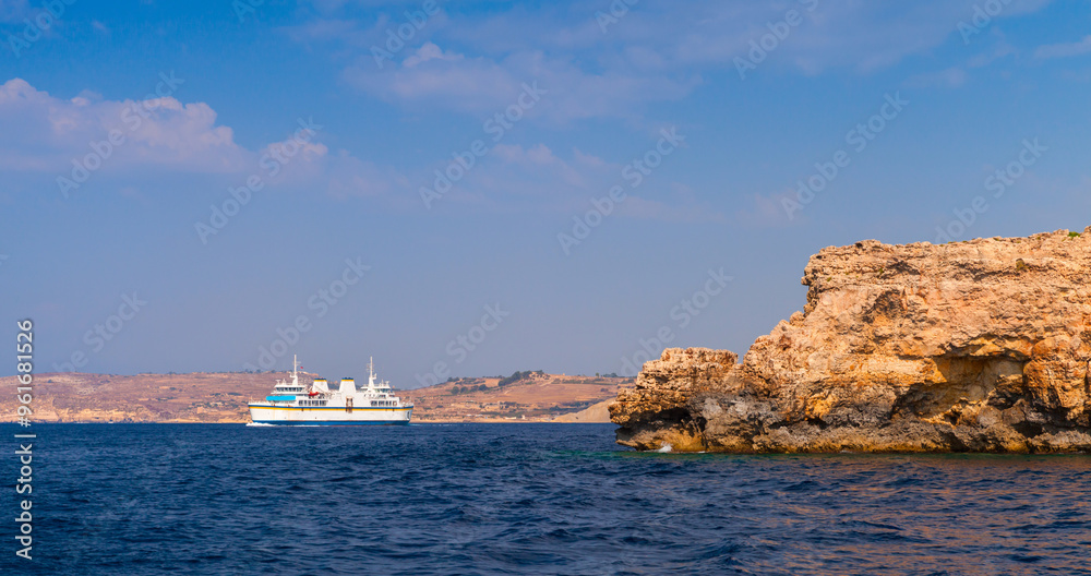 Ferry ship sails the Mgarr bay, Malta Ferry ship sails the Mgarr bay, Malta