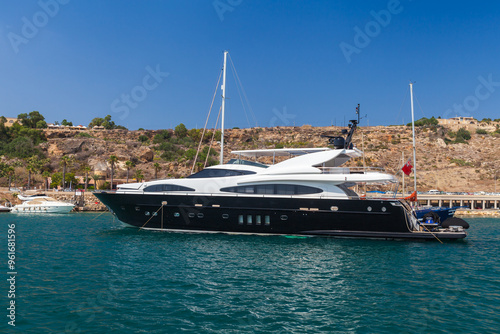Pleasure motor yacht is in Mgarr bay, Malta
