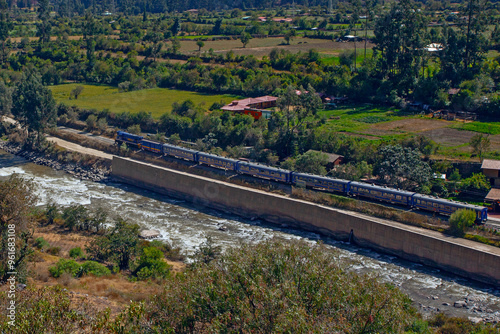 Train heading through the Andes in Peru with stunning landscape, Ollantaytambo is the last stop to get train to Machu Picchu at Peru