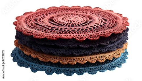  a stack of four round doilies. The doilies are made of crocheted yarn in different colours - red, orange, blue, and black. 