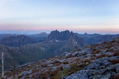 Children and adults, family with dog, hiking Grytetippen trail in Senja, Lofoten on a sunny summer day photo