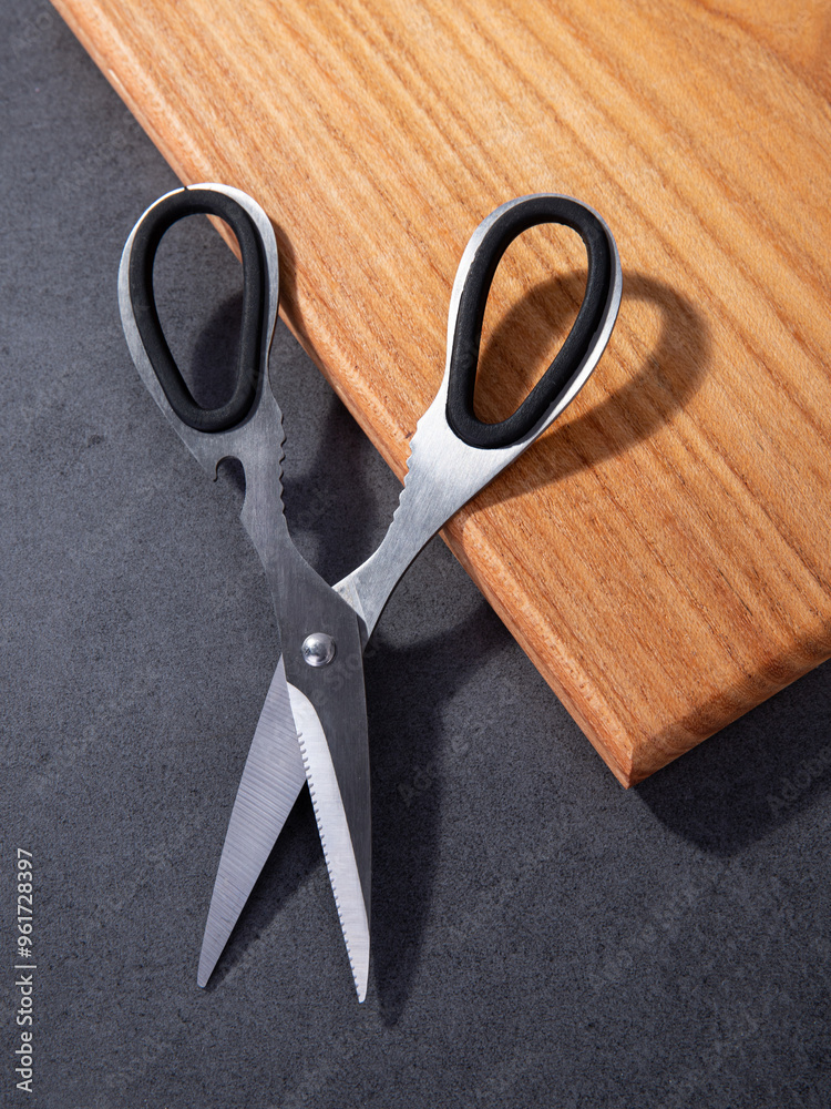 kitchen iron scissors on a wooden cutting board kitchen iron scissors on a wooden cutting board
