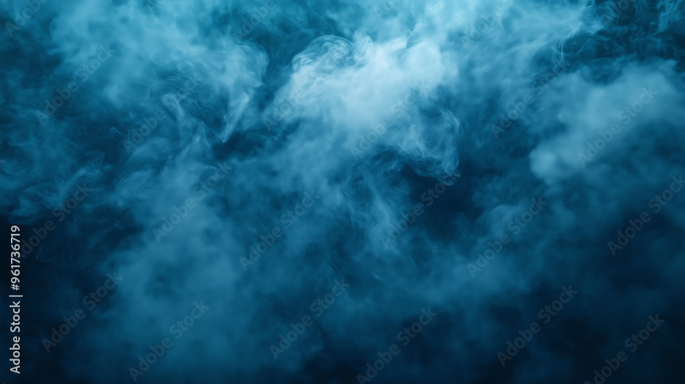 Blue smoke billows against a dark background Blue smoke billows against a dark background
