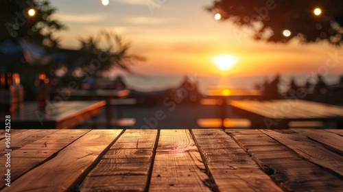 Obraz na płótnie Blurred sunset background with empty wooden table and bar counter. w salonie