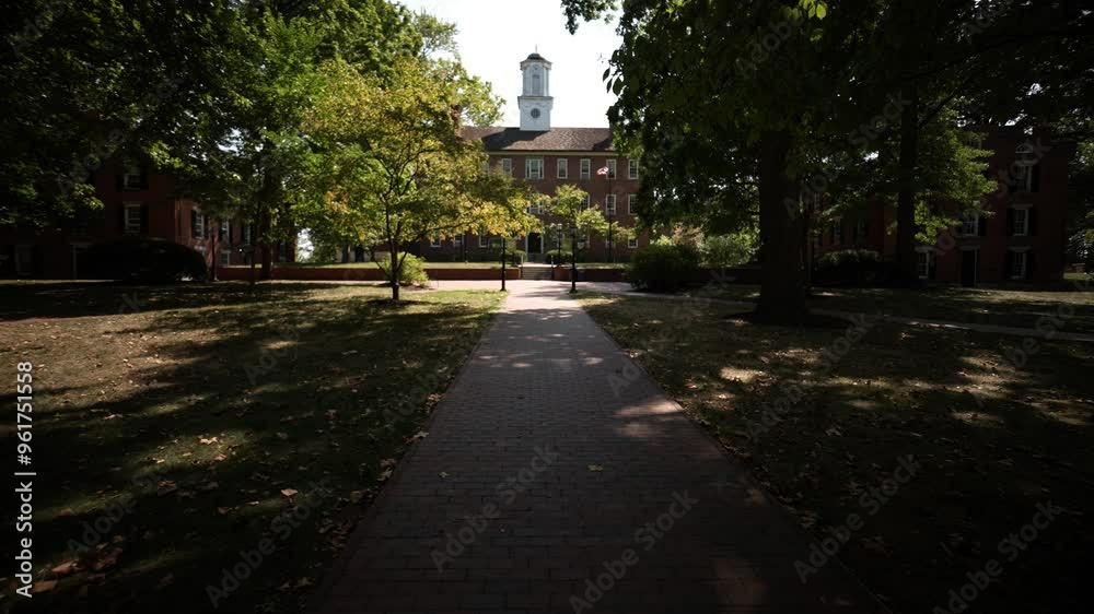Cutler Hall on the College Green view through the trees at University of Ohio in Athens OH. Cutler Hall on the College Green view through the trees at University of Ohio in Athens OH.