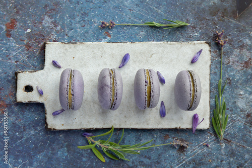 Purple french macaroons  on the blue background photo