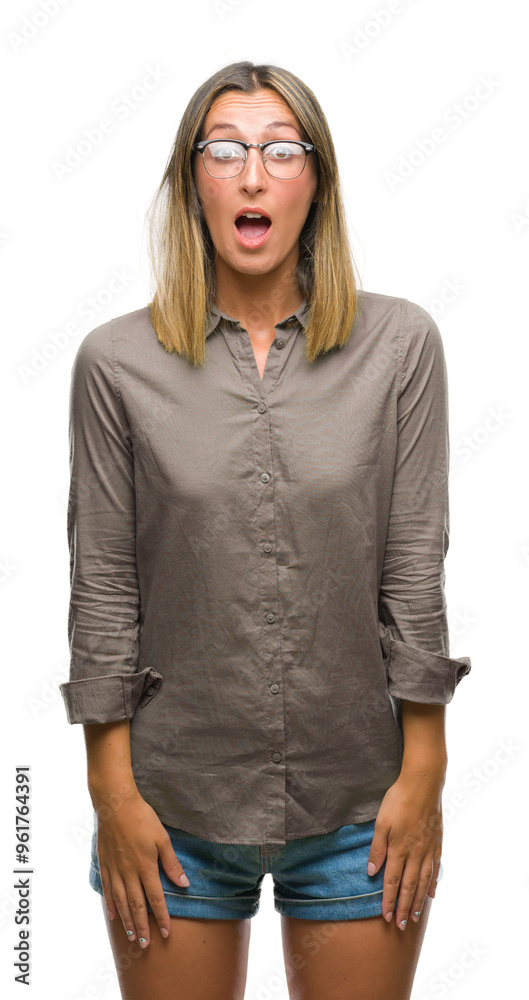 Young beautiful woman over isolated background afraid and shocked with surprise expression, fear and excited face. Young beautiful woman over isolated background afraid and shocked with surprise expression, fear and excited face.