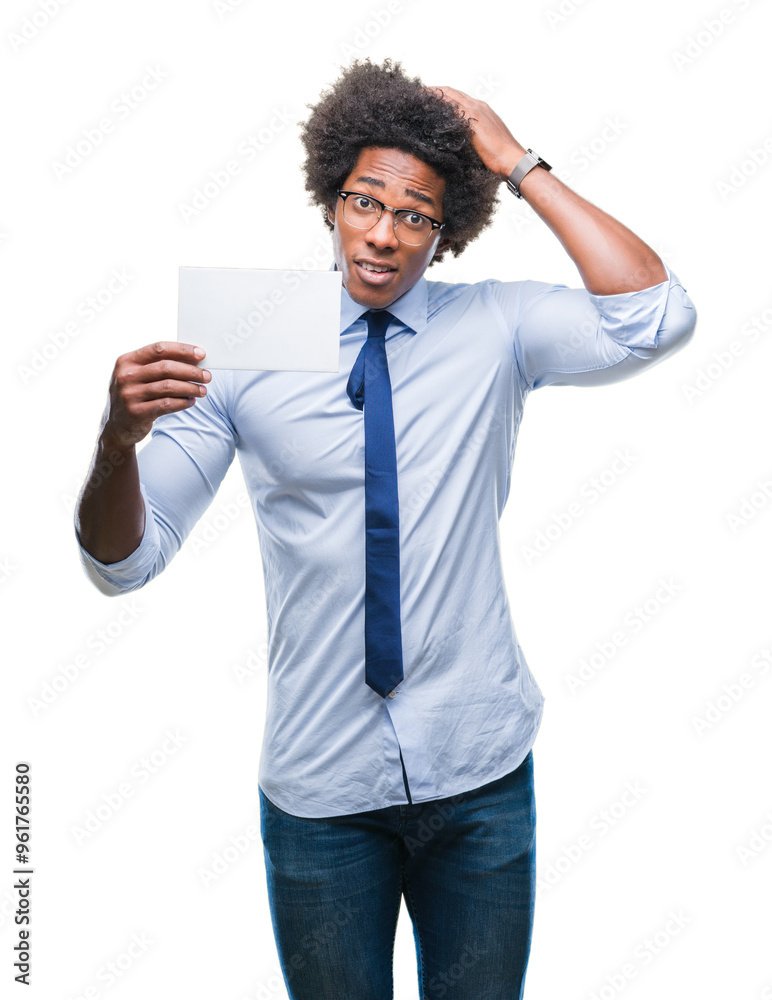 Afro american man holding blank card over isolated background stressed with hand on head, shocked with shame and surprise face, angry and frustrated. Fear and upset for mistake. Afro american man holding blank card over isolated background stressed with hand on head, shocked with shame and surprise face, angry and frustrated. Fear and upset for mistake.