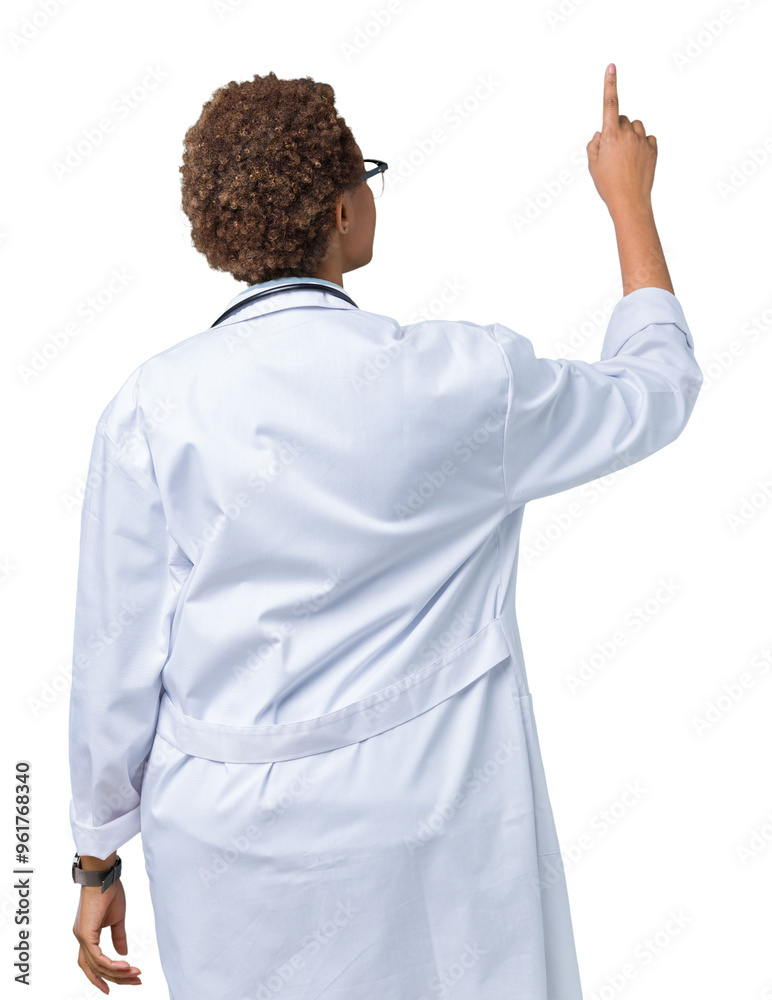 Young african american doctor woman wearing medical coat over isolated background Posing backwards pointing behind with finger hand