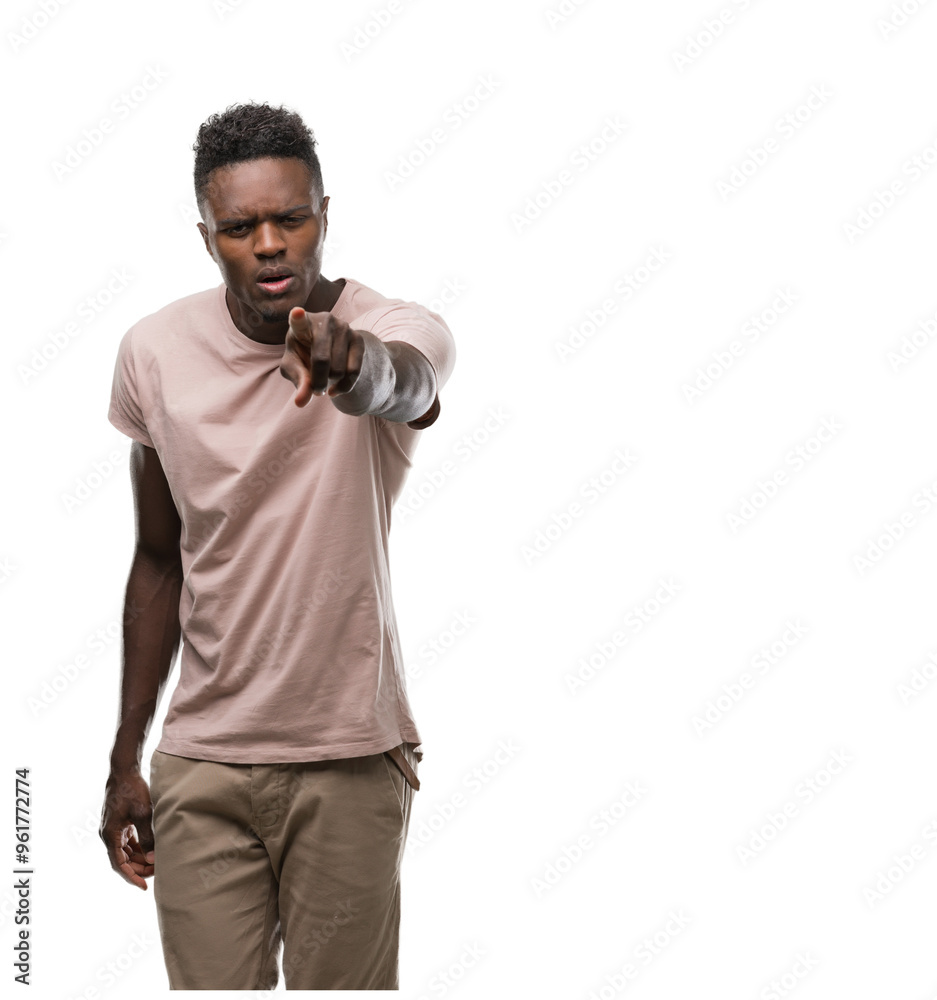 Young african american man pointing with finger to the camera and to you, hand sign, positive and confident gesture from the front Young african american man pointing with finger to the camera and to you, hand sign, positive and confident gesture from the front