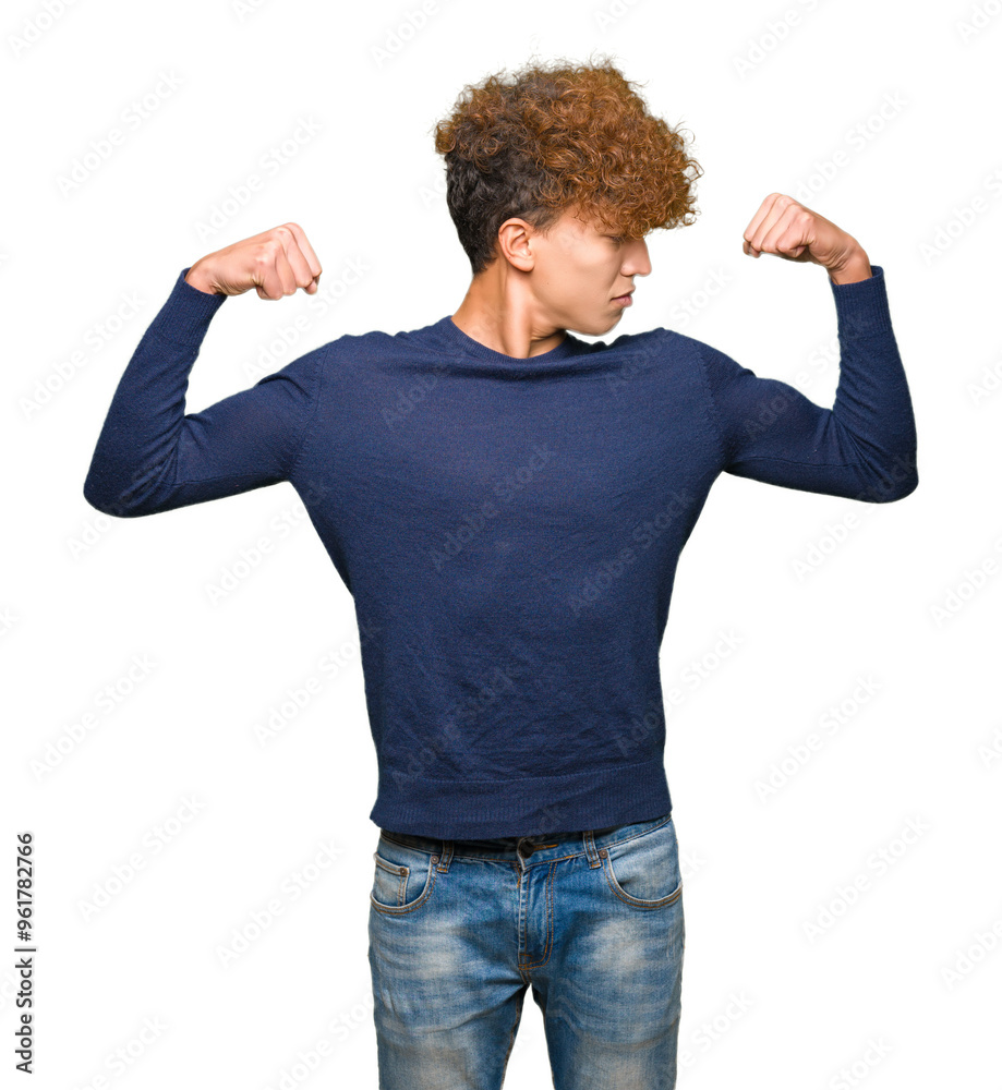 Young handsome man with afro hair showing arms muscles smiling proud. Fitness concept. Young handsome man with afro hair showing arms muscles smiling proud. Fitness concept.