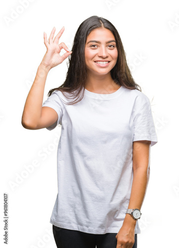 Young beautiful arab woman over isolated background smiling positive doing ok sign with hand and fingers. Successful expression. photo