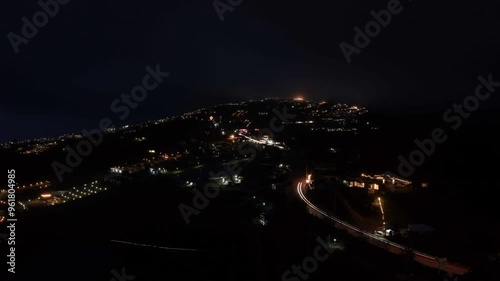 Day to Night Timelapse flowing clouds and village in the valley with light driving car at Phu Tub Berk, long exposure concept. 4k photo