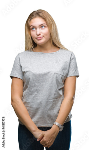 Young caucasian woman over isolated background smiling looking side and staring away thinking.