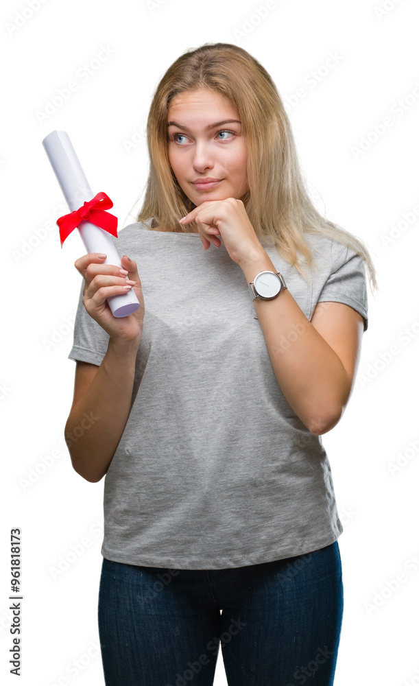 Young caucasian woman holding degree over isolated background serious face thinking about question, very confused idea Young caucasian woman holding degree over isolated background serious face thinking about question, very confused idea