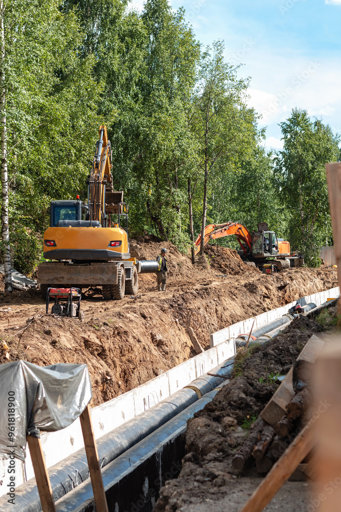 A pipeline is being replaced on the street. A pipeline is being replaced on the street.